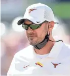  ?? JAY JANNER/AUSTIN AMERICAN STATESMAN/ USA TODAY NETWORK ?? Texas head coach Tom Herman leads his team during warmups before a game against West Virginia at Royal-memorial Stadium on Nov. 7.