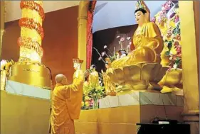  ?? Nate Guidry/Post-Gazette ?? The Most Ven. Sakya Tri-Tue, president of the Vietnamese Buddhist Associatio­n, offers a blessing Sunday during the dedication of a new Vietnamese Buddhist temple in Dormont.