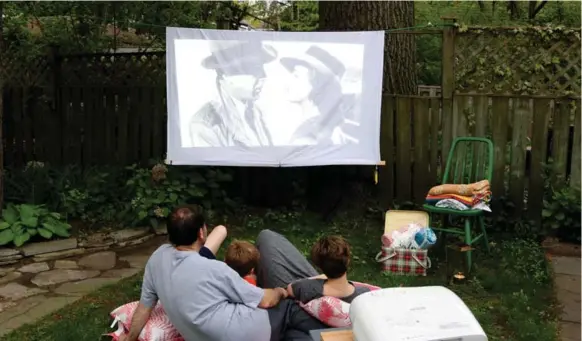  ?? DEBRA NORTON ?? While a backyard screening under the stars is a great way to enjoy time with friends and family, it can take some planning, from acquiring a projector to preparing food.