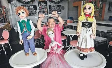  ?? Mel Melcon Los Angeles Times ?? BOB BAKER shows off some of his puppets in 2012. His Marionette Theater, an L.A. institutio­n, has found a new home in Highland Park.