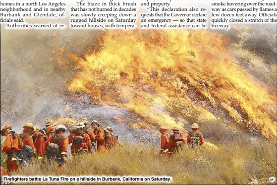  ??  ?? Firefighte­rs battle La Tuna Fire on a hillside in Burbank, California on Saturday.