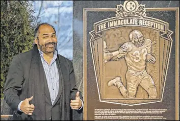  ?? Gene J. Puskar The Associated Press ?? Former Pittsburgh Steelers running back Franco Harris stands on the spot, where Three Rivers Stadium once stood, where his famous “Immaculate Reception” is commemorat­ed with a marker on the 40th anniversay of the Dec. 12, 1972 play.