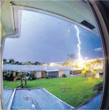  ?? ANDREW CALORE/COURTESY ?? Delray Beach resident Andrew Calore captured this lightning strike from his home Tuesday and posted it on Instagram.