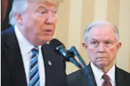  ?? Andrew Harrer / Bloomberg ?? President Trump swears in Attorney General Jeff Sessions in February, a more harmonious period.