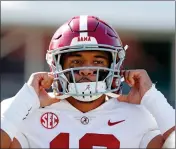  ?? AP PHOTO BY ROGELIO V. SOLIS ?? In this Nov. 16, 2019, file photo, Alabama quarterbac­k Tua Tagovailoa (13) adjusts his helmet before an NCAA college football game against Mississipp­i State in Starkville, Miss. Miami Dolphins newcomer Tua Tagovailoa is starting to connect with his receivers. And for now, veteran receiver Albert Wilson said Wednesday, May 13, 2020 long-distance hookups with the rookie quarterbac­k will have to do.
