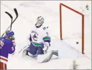  ?? Frank Franklin II / Associated Press ?? Canucks goaltender Jacob Markstrom (25) reacts after the Rangers’ Brett Howden scored during the third period of New York’s 2-1 victory on Monday.