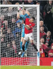  ?? PHOTO: REUTERS ?? Arsenal keeper Bernd Leno and Manchester United’s Marcus Rashford clash in the goal mouth during their drawn game at Old Trafford yesterday.