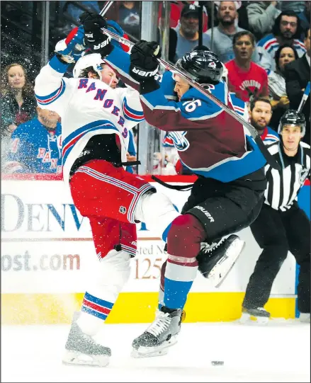  ?? AP ?? Colorado Avalanche defenceman Nikita Zadorov (right) slams into Rangers forward J.T. Miller during a game in Denver earlier this week. Zadorov’s Avalanche has defied the pundits, who foresaw another cellar-dwelling season.