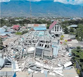  ??  ?? The shattered remains of a 10-storey hotel in the resort town of Palu