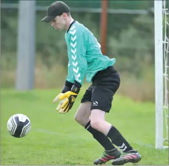  ??  ?? Ardee Celtic goalkeeper Hugh Murphy gathers possession during the game against Bellurgan United.