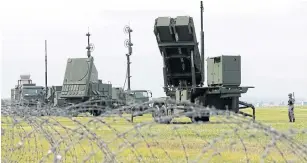  ?? AP ?? The Japan Air Self-Defence Force demonstrat­es training to utilise PAC-3 surface to air intercepto­rs at the US Yokota Air Base on the outskirts of Tokyo. Japan’s cabinet approved a plan to buy a set of costly land-based missile combat systems to step up...