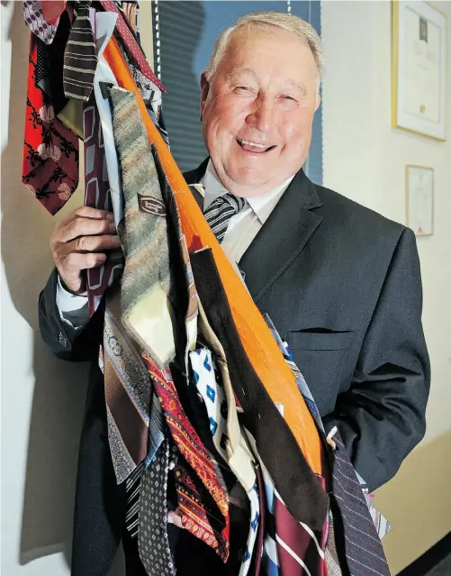  ?? Larry Wong/ Edmonton Journal ?? John Chomiak, longtime president and CEO of Hemisphere Engineerin­g, likes a good laugh. He cut the neckties worn by 40 latenight revellers at a company Christmas party one year and now sports a large collection at his office in Edmonton.