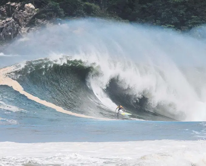  ?? Picture: WSL ?? That speck on a surfboard is Coast waterman Jamie Mitchell dominating the monster waves at this year’s Puerto Escondido Challenge, finishing second.