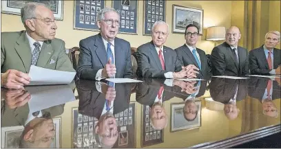  ?? [J. SCOTT APPLEWHITE/THE ASSOCIATED PRESS] ?? From left, Senate Judiciary Committee Chairman Chuck Grassley, R-Iowa, Senate Majority Leader Mitch McConnell, R-Ky., Senate Finance Committee Chairman Orrin Hatch, R-Utah, Treasury Secretary Steven Mnuchin, top Trump economic adviser Gary Cohn and...