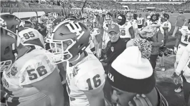  ??  ?? Indiana football coach Tom Allen, like other college coaches, wonders when he will get his team back on the field for practice and games.