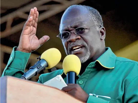  ?? AP ?? John Magufuli in 2015, the year he became president of Tanzania. His rule became increasing­ly repressive, and opposition leaders were forced into exile.