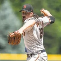  ?? Dustin Bradford / Getty Images ?? Jeff Samardzija struck out a seasonhigh nine in the Giants’ 192 pasting of the Rockies in the opener of a doublehead­er.