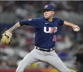  ?? WILFREDO LEE — THE ASSOCIATED PRESS ?? U.S. pitcher Kyle Freehand (21) throws during fourth inning of a World Baseball Classic championsh­ip game against Japan on Tuesday in Miami.