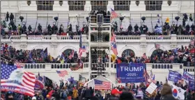  ?? (AP/John Minchillo) ?? Supporters of President Donald Trump breach the U.S. Capitol during the Jan. 6, 2021 riot.