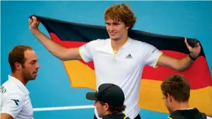  ?? AFP ?? Alexander Zverev of Germany (top) and team celebrate his victory over Nick Kyrgios. —
