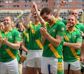  ??  ?? The Buffers Alley players react as their captain, Ciarán Kenny, is presented with the cup.