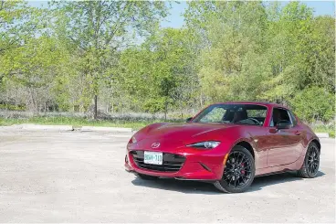  ?? CLAYTON SEAMS ?? The 2018 Mazda MX-5 RF is a lot of fun to drive, despite its lacklustre engine. Unfortunat­ely, the near $50,000 price tag is a tough pill to swallow.