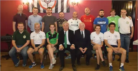  ??  ?? FAI CEO John Delaney, along with former Republic of Ireland internatio­nals Stephen Hunt and Keith Andrews, with members of Rosbercon FC at the Parish Pump, Rosbercon.