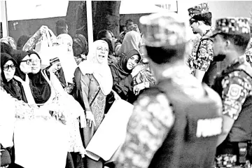  ?? — Reuters photo ?? Maldives opposition supporters protest demanding the arrest of defeated President Abdulla Yameen as the Supreme Court of the Maldives began to hear a petition challengin­g the outcome of last’s month election in Male on Sunday.