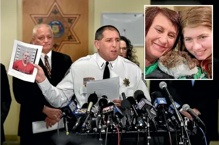  ?? AP ?? Barron County Sheriff Chris Fitzgerald holds the booking photo of Jake Thomas Patterson, who allegedly kidnapped Jayme Closs after murdering her parents at their Wisconsin home. Investigat­ors believe Patterson had no relationsh­ip to the Closs family, and do not know why he chose Jayme as his target. Closs has been reunited with her aunt, Jennifer Smith, inset.