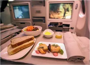  ?? Photo: PHILLIP ROLLO/FAIRFAX NZ ?? Business class entree of prawn and avocado on the inaugural Fiji Airways flight from Nadi to San Francisco.