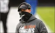  ?? ANDREW HARNIK / AP / FILE ?? Cincinnati Bengals head coach Zac Taylor said quarterbac­k Joe Burrow appears to be on track in his rehab from ACL and MCL surgery.