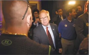  ?? H John Voorhees III / Hearst Connecticu­t Media ?? Mark Boughton, mayor of Danbury and the endorsed Republican candidate for governor, talks with supporters after losing the primary Tuesday. Boughton held his primary night party at La Bella Vista in Waterbury.