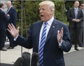  ?? AP PHOTO ?? President Donald Trump speaks with reporters in Washington on Friday.