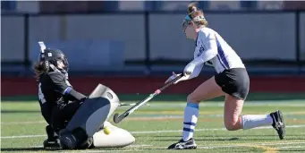  ?? STUART CAHILL / HERALD STAFF ?? DENIED: Abigail Gramer (right) of Dover-Sherborn has her shot turned away by Hopedale’s Piper Hampsch in the Div. 2 state final.