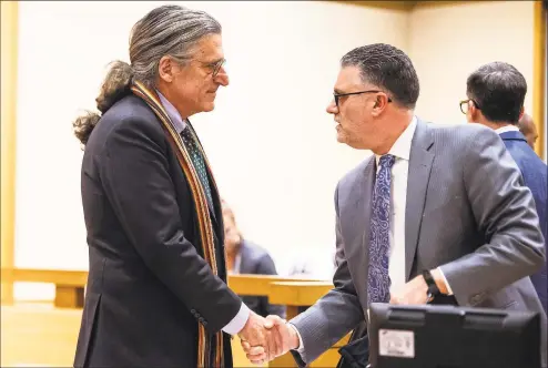 ?? Kassi Jackson / Associated Press ?? Norm Pattis, left, Fotis Dulos’ attorney, shakes hands with Stamford State’s Attorney Richard Colangelo after they reached an agreement during a bond hearing for Dulos, who at the time was in critical condition in a New York hospital after a suicide attempt, at state Superior Court in Stamford on Jan. 29.