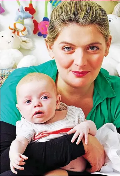  ?? Picture: DAN BURN-FORTI/SUNDAY TELEGRAPH ?? Second fiddle: Bryony with her daughter Edie as a baby