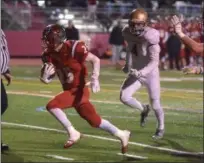  ?? PETE BANNAN — DIGITAL FIRST MEDIA ?? Upper Dublin’s (25) Lucas Roselli scores a touchdown in the second quarter against West Chester Rustin in the District 1-5A final last Friday.