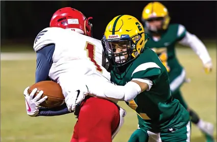  ??  ?? Holtville High cornerback Daniel Bejarano (right) tackles a ball carrier during the Vikings’ home CIF-SDS Div. V quarterfin­als game against Mountain Empire High on Friday night at Birger Field in Holtville. PHOTO VINCENT OSUNA