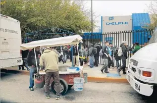  ??  ?? WORKERS LEAVE the Delphi factory after a shift is over in Juarez. If the U.S. were to withdraw from NAFTA and start taxing imports from Mexico, Delphi would continue to do business there.