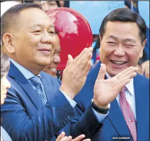  ?? EDD GUMBAN ?? Newly appointed Chief Justice Diosdado Peralta (left) shares a light moment with acting chief Antonio Carpio, who is set to retire on Oct. 26, during the flag-raising ceremony at the Supreme Court on Monday.