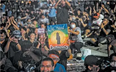  ?? VIVEK PRAKASH/GETTY-AFP ?? Tens of thousands of demonstrat­ors defied police warnings and occupied a historic field in Thailand’s capital Saturday to support a student-led protest movement for new elections and reform of the monarchy. Organizers had predicted that as many as 50,000 people would take part in the protest at Sanam Luang.