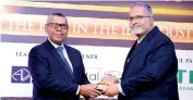  ??  ?? Amãna Bank’s Senior VP – Treasury and Financial Institutio­ns M. Pharis Jazeel collecting the Entity of the Year Award from KPMG Managing Partner Reyaz Mihular