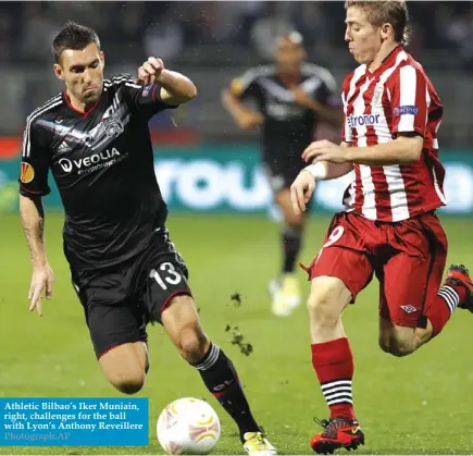 ?? Photograph:AP ?? Athletic Bilbao’s Iker Muniain, right, challenges for the ball with Lyon’s Anthony Reveillere