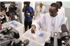  ??  ?? OUAGADOUGO­U: Burkina Faso’s Prime Minister Issac Zida casts his vote for the presidenti­al election at a polling station in Ouagadougo­u yesterday. — AFP