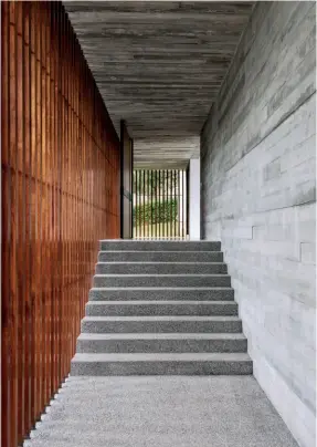  ??  ?? Outdoor spaces still feel private and secure; Timber screens in many forms appear throughout the house; One of two of the spiral staircases