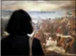  ?? CHRISTOPHE ENA — THE ASSOCIATED PRESS ?? A woman watches “La bataille de Nancy” by Eugene Delacroix at the Louvre museum, in Paris.