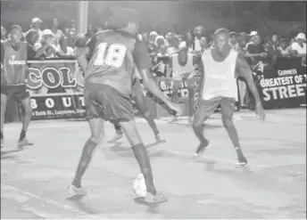  ??  ?? Amoniki Rodgers (no.18) of Camp Street All-Stars trying to initiate an attacking play while being guarded by Eusi Phillips (right) of Sparta Boss during their quarterfin­al affair at Demerara Park in the Guinness ‘Greatest of the Streets’ Championsh­ip...