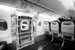  ?? ?? A door plug area of an Alaska Airlines Boeing 737 Max 9, with panelling removed, is shown prior to inspection at Seattle-Tacoma Internatio­nal Airport.