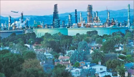  ?? Mel Melcon Los Angeles Times ?? REGULATORS VOTED to cut fewer pollutants from refineries and others than staff proposed. Above, Chevron’s El Segundo refinery.
