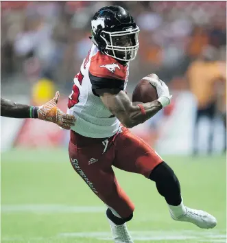  ?? DARRYL DYCK/ THE CANADIAN PRESS ?? Marquay McDaniel runs with the ball following a catch against B.C. last week. McDaniel has had terrific chemistry with QB Bo Levi Mitchell since the two were new Stamps.